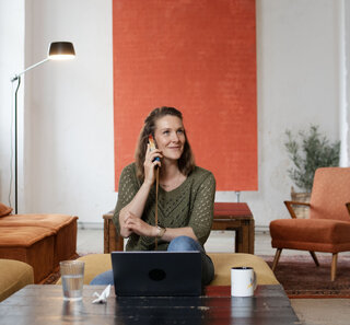 Image of a person talking on the phone